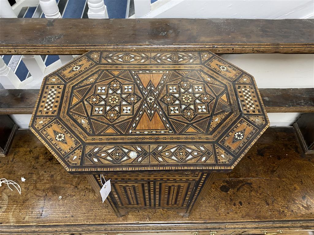 A Moorish octagonal mother of pearl inlaid work table, width 50cm, depth 33cm, height 56cm